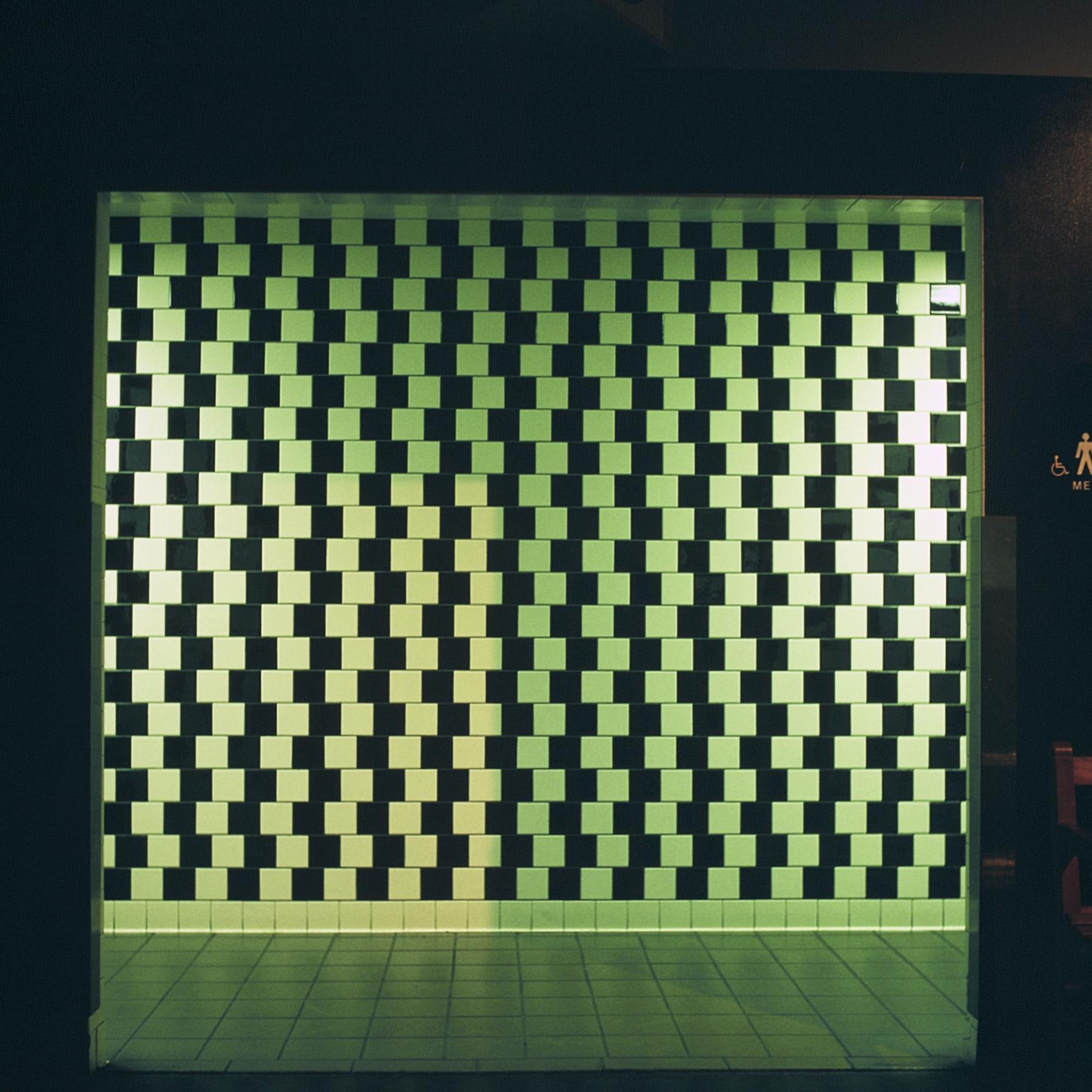 Cafe wall illusion bathroom detail.