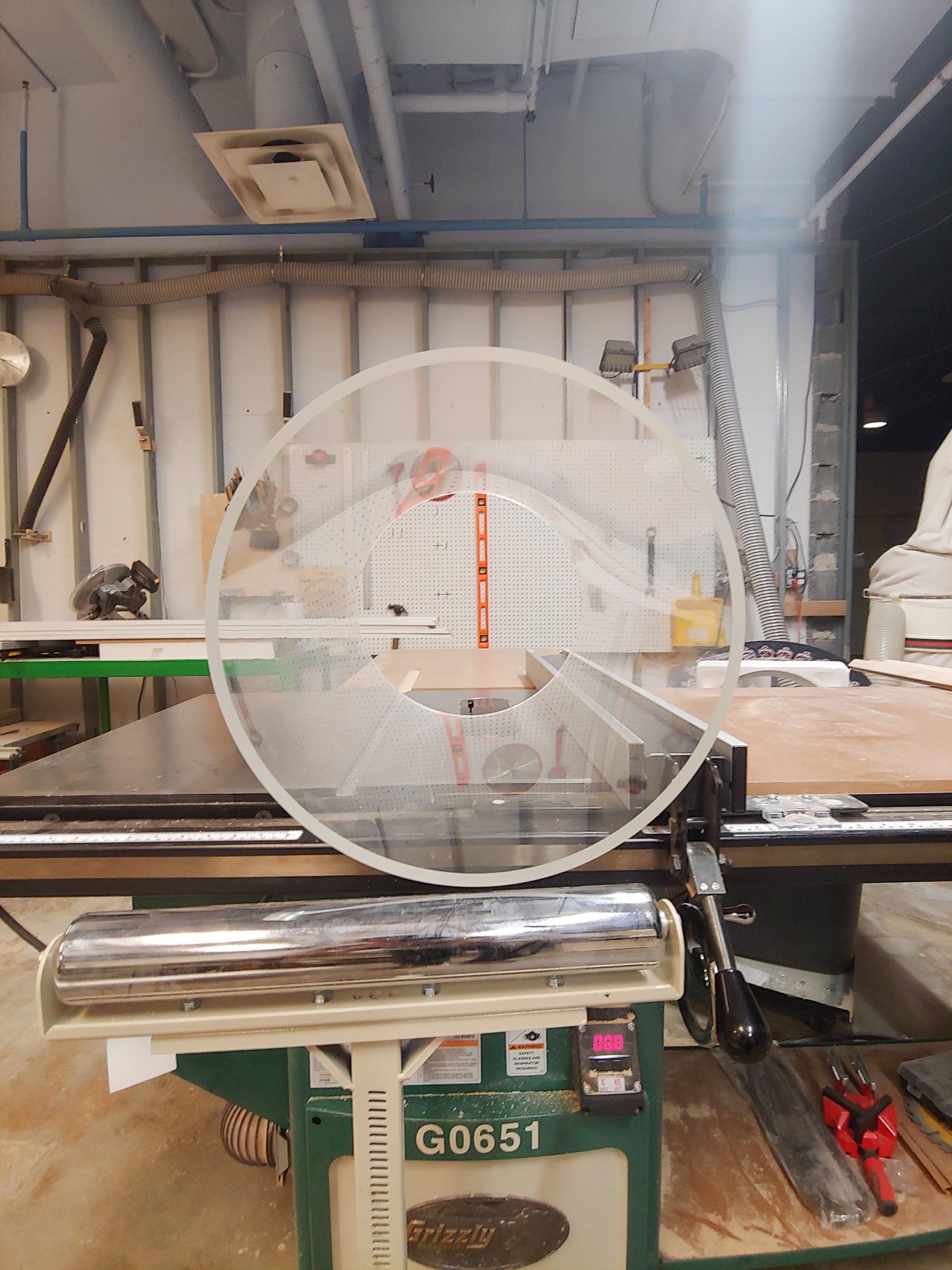 Next cut the acrylic glass pipe on the table saw.